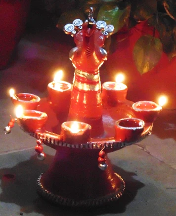 This image is showing deepam aarti using Til oil or sesame oil.